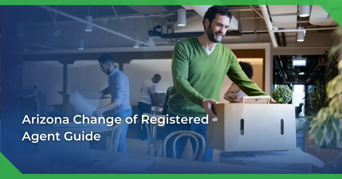 Man in a green sweater smiling and carrying a box in an office setting. Others are packing or working. Text reads Arizona change of registered agent for a nonprofit.