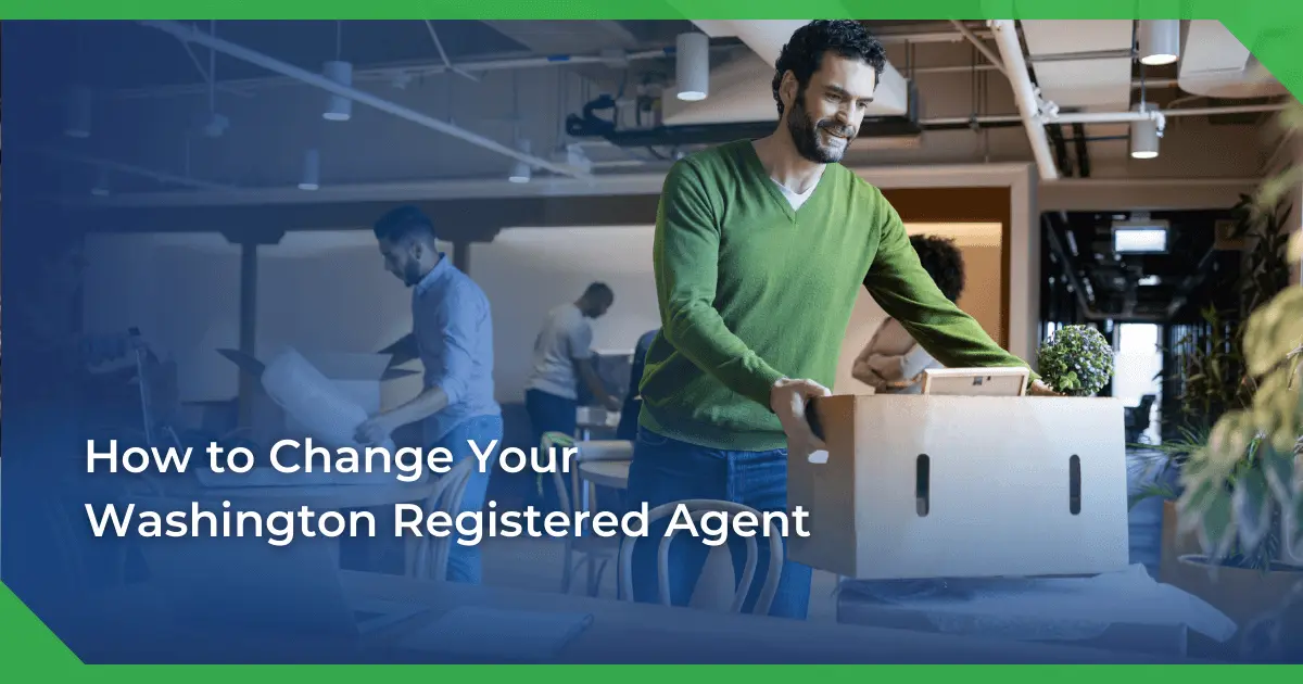 Man in a green sweater smiling and carrying a box in an office setting. Others are packing or working. Text reads Washington change of registered agent for a nonprofit.
